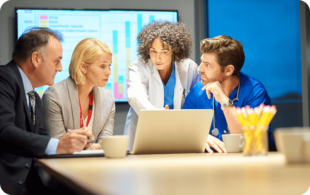 Professionals discussing project at conference table